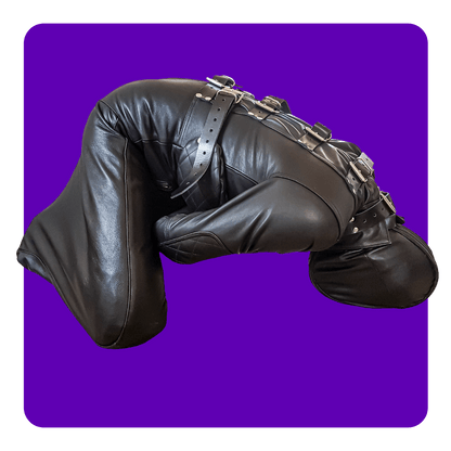 Leatherprison puppy suit, straitjacket style top, legs bent, leather bondage, fetish, dungeon, sub, slave, dom